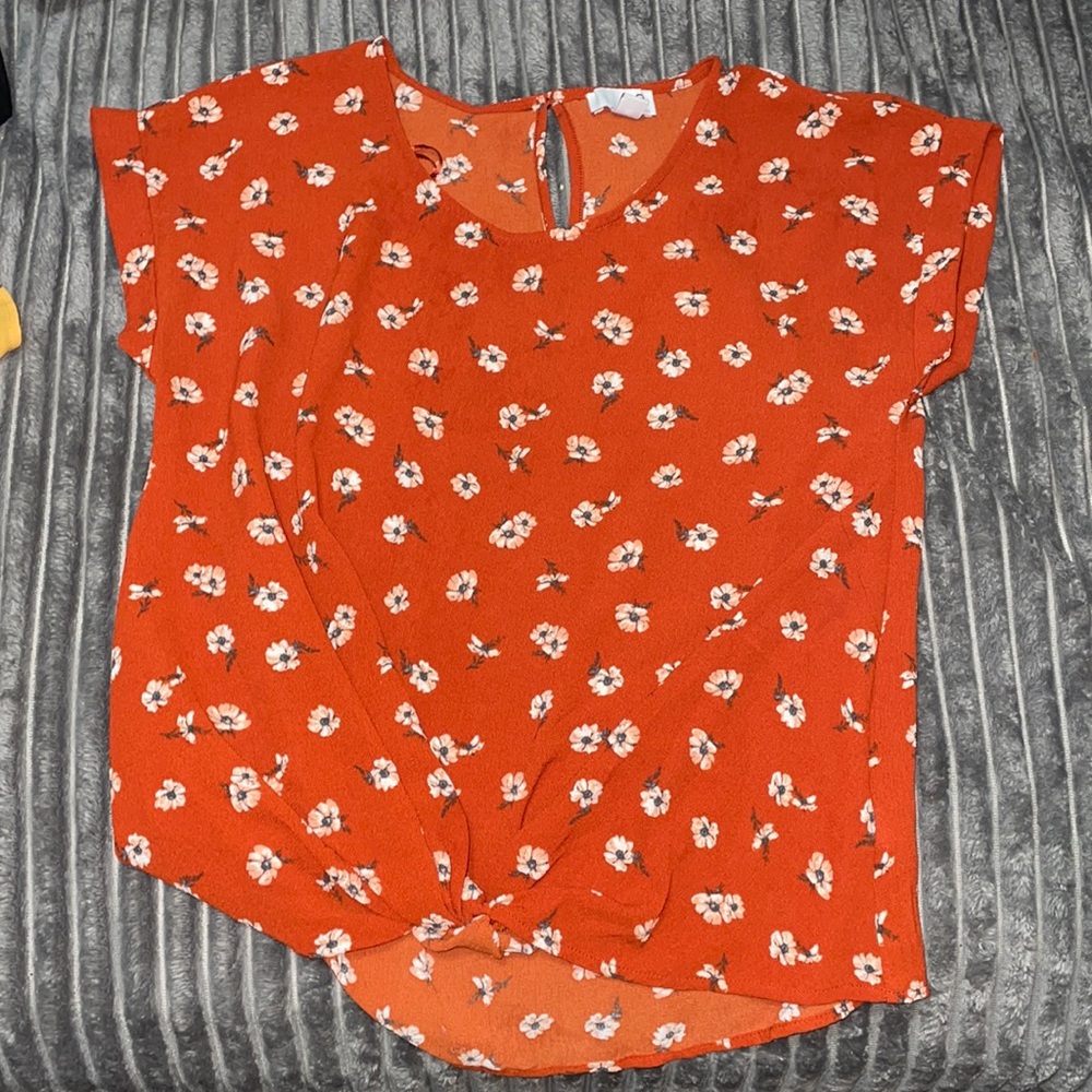 Orange top with white flowers